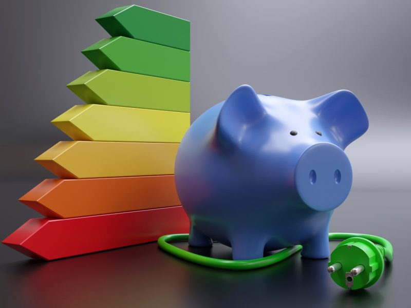 Home electric power green plug, energy class efficiency chart and piggy bank. House electricity cost saving. 3d render
